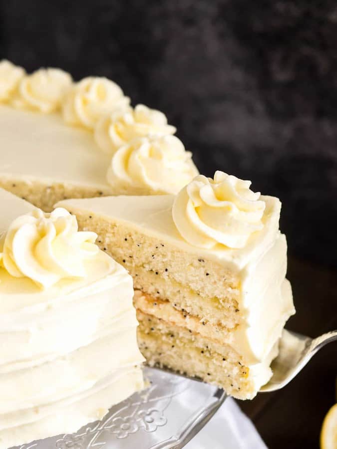 A dreamy Lemon Poppy Seed Cake that’s laced with flecks of poppy seeds and topped with a lemon curd frosting. This lemon layer cake is one of my favorite cakes for spring and summer!