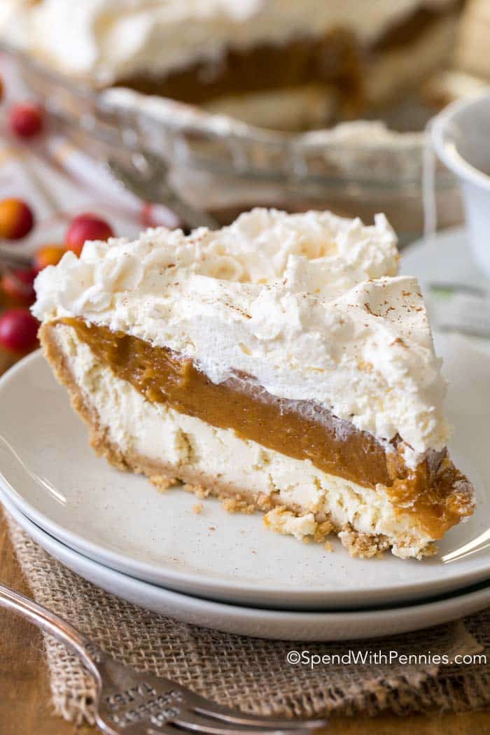  No Bake Pumpkin Cheesecake is a dreamy dessert with layers of cheesecake, spiced pumpkin and whipped topping all nestled in a graham crust. It is so creamy and delicious, it will become your new fall dessert go to!