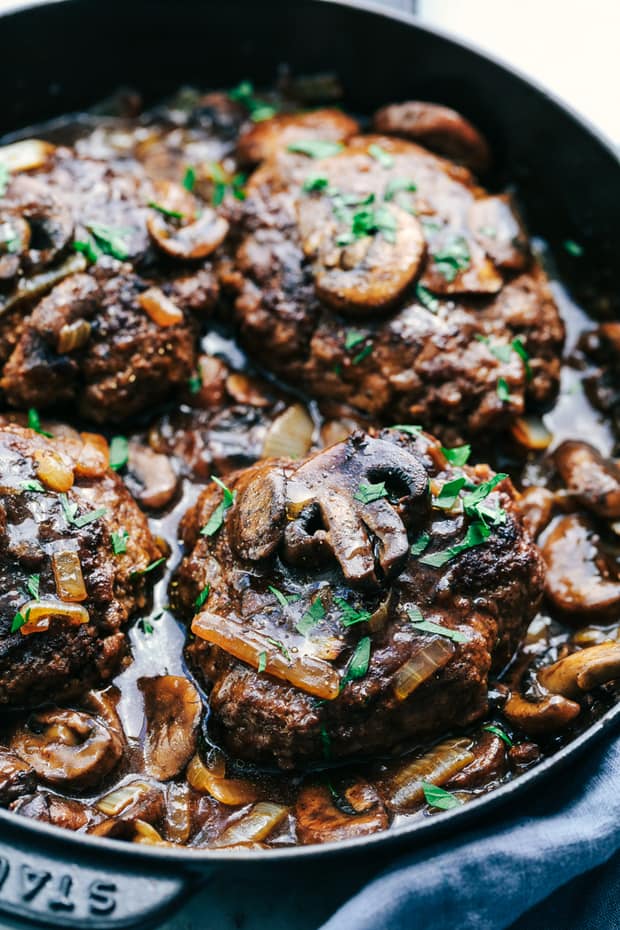 Skillet Salisbury Steak is a classic meal with a mouthwatering tender beef patty drowning in a rich homemade brown gravy. Serve it over some mashed potatoes and peas and you have yourself a winner!