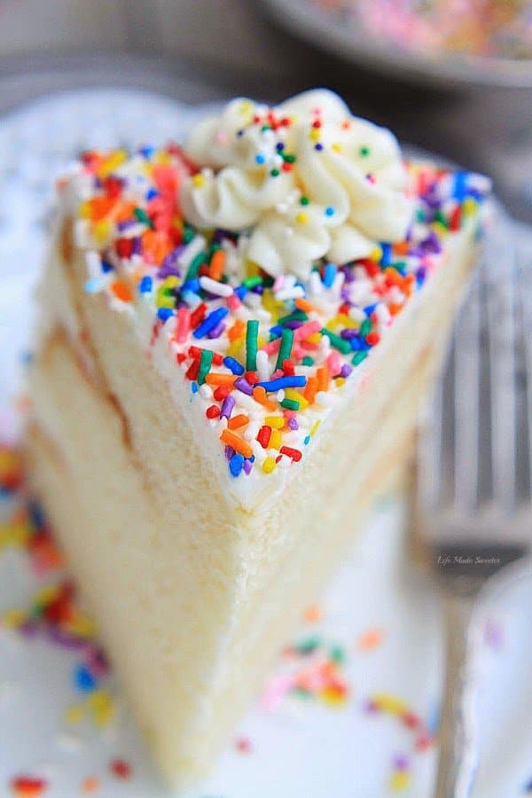 A light, fluffy and delicious frosted vanilla cake with sprinkles – perfect for a birthday or any celebration!