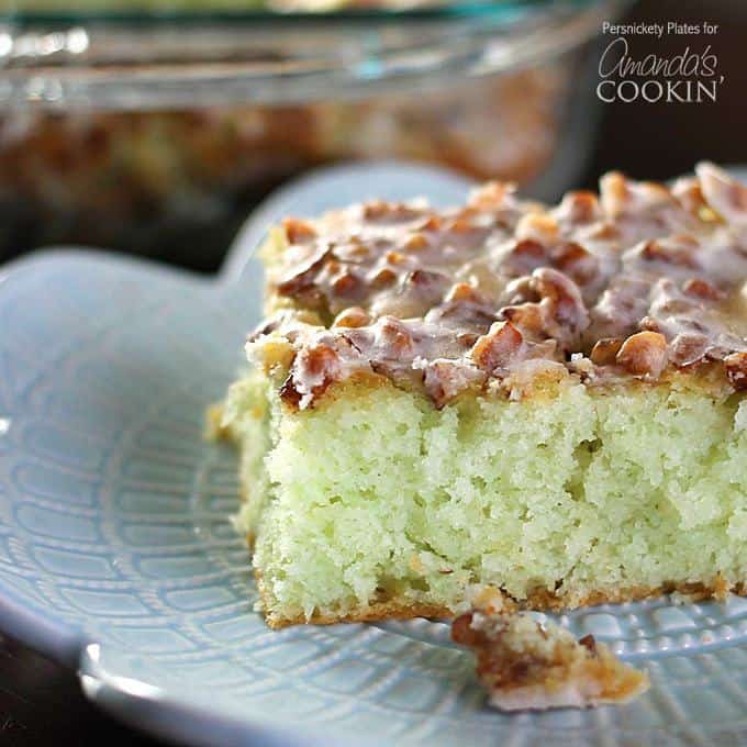 Pistachio Poke Cake starts with a cake mix so it’s super easy and always a crowd pleaser. I’ve never made this cake without being asked for the recipe! Topped with pecans and filled with delicious pistachio pudding, this cake is simple yet irresistible!