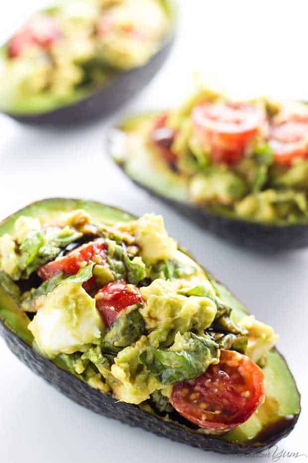This easy Caprese stuffed avocado recipe is healthy & delicious! It's so simple to make with common ingredients you probably have right now.