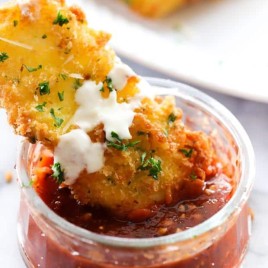 Fried Mozzarella is simple, delicious and a perfect appetizer. The outside is crispy with a gooey soft cheesy inside. It is drizzled with Alfredo and paired with Marinara. The flavor combo makes this one outrageously tasty party food!