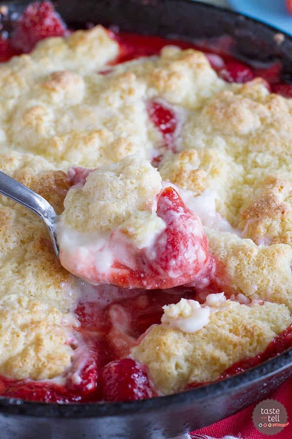 Perfect for serving and eating with friends, this Strawberries and Cream Skillet Cobbler is down-home deliciousness.