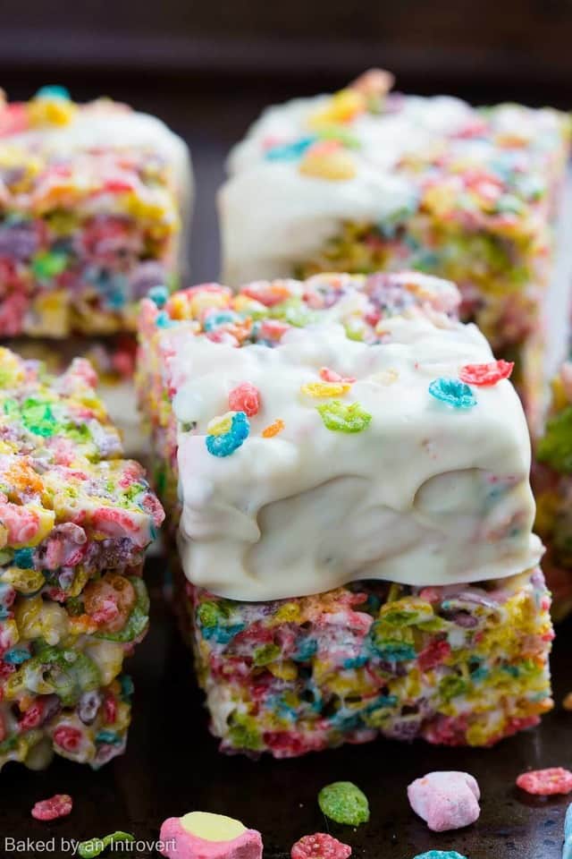 Are you looking for a fun way to turn cereal into a dessert? These Marshmallow Fruity Pebble Bars are the easiest, creative treats you will find! Made with Marshmallow Fruity Pebbles cereal and melty marshmallows for glue, the bars are beyond simple. Each one is dipped in white chocolate and sprinkled with a few pieces of cereal, making them extra festive for any occasion. This dessert is so easy and will have everyone excited to recreate it in their own kitchen!