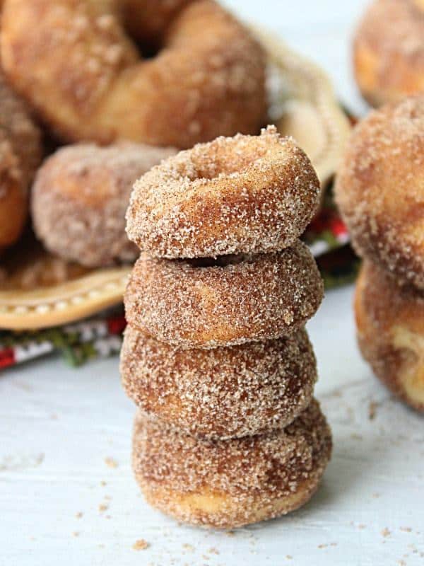 These Mini Baked Cider Doughnuts are pretty simple to make and taste delicious. A great sweet flavor with a buttery, cinnamon topping.  From this recipe, you get quite a few doughnuts. I made 24 mini doughnuts and 12 regular size doughnuts..so, lots of doughnuts to pig out on.