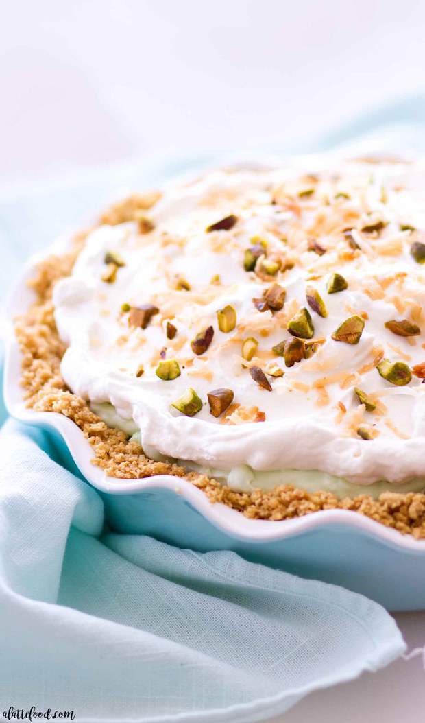 This homemade no bake pistachio pudding cream pie is layers of graham cracker crust, pistachio pudding cream, and whipped cream!