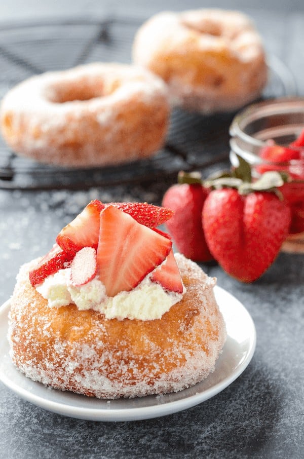 Easy Strawberry Shortcake Donuts come together super quick since they use canned biscuits! And I know you might think that sounds crazy, but I swear they make awesome donuts and you don’t have to wait for dough to rise.