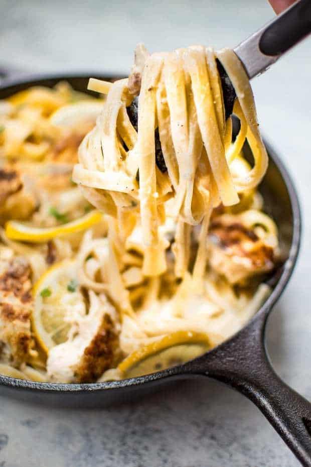 This Lemon Parmesan Chicken Alfredo recipe is a delicious and decadent way to enjoy pasta! The sauce is irresistibly creamy with plenty of lemon and garlic! The tender breaded chicken adds another layer of comfort and flavor to this easy fettuccine Alfredo pasta dish.