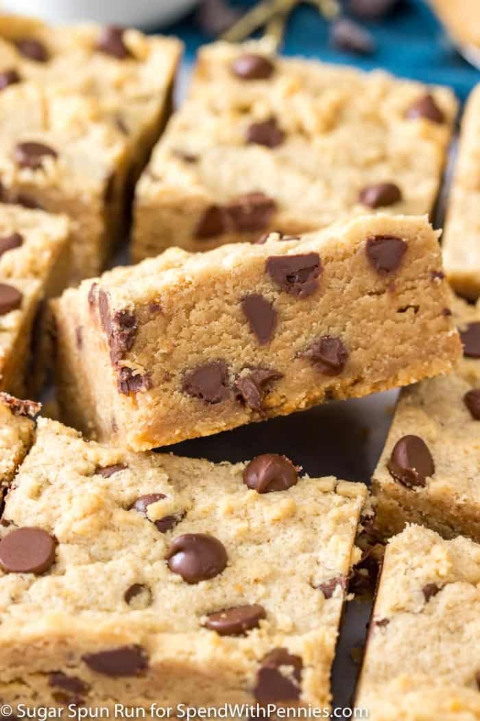  These cookie bars are made extra thick in a 9×9 pan and are loaded with creamy peanut butter and packed full of chocolate chips!
