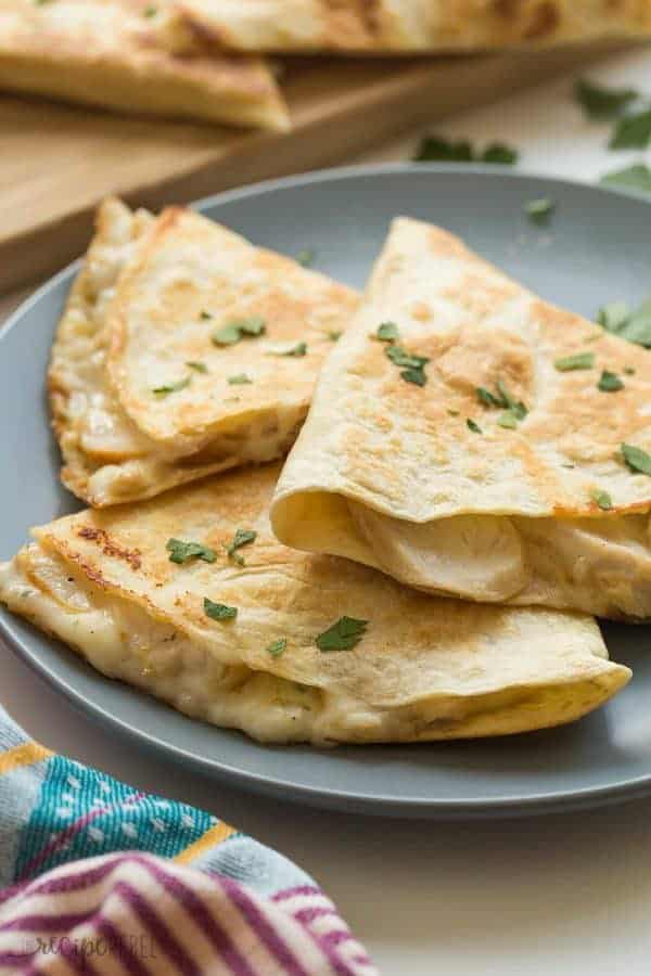 These Chicken Alfredo Quesadillas are an easy lunch, dinner or snack! They’re filled with leftover chicken, Alfredo sauce and cheese — easy comfort food! A 10 minute meal.