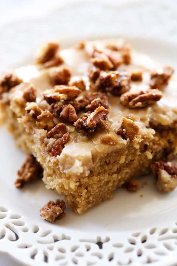A moist and delicious brown sugar sheet cake with an amazing caramel frosting. The sheet cake is topped wight he most delicious sweet and crunchy pralines for a perfect bite each and every time!