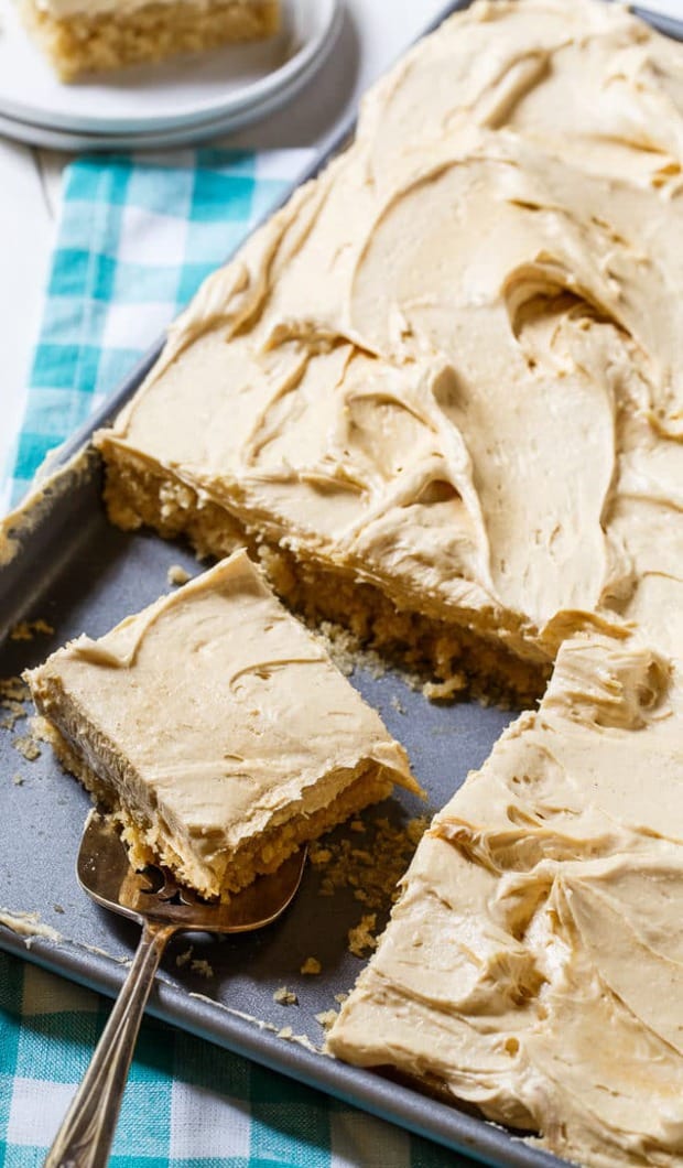 Peanut Butter Sheet Cake is a moist sheet cake topped with a super creamy and sweet peanut butter icing. It is a peanut butter lover’s dream and perfect for potlucks and picnics.