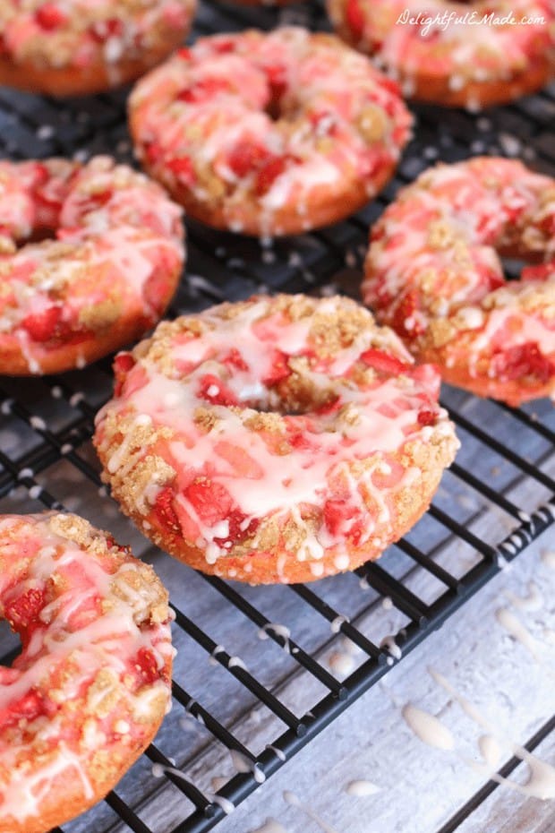 Have you ever tried baking donuts?  If not, now is the time to start.  These Strawberry Coffee Cake Donuts are loaded with fresh, chopped strawberries, topped with coffee cake streusel and drizzled with glaze.  Breakfast treats have never been more pretty or tasty as these!
