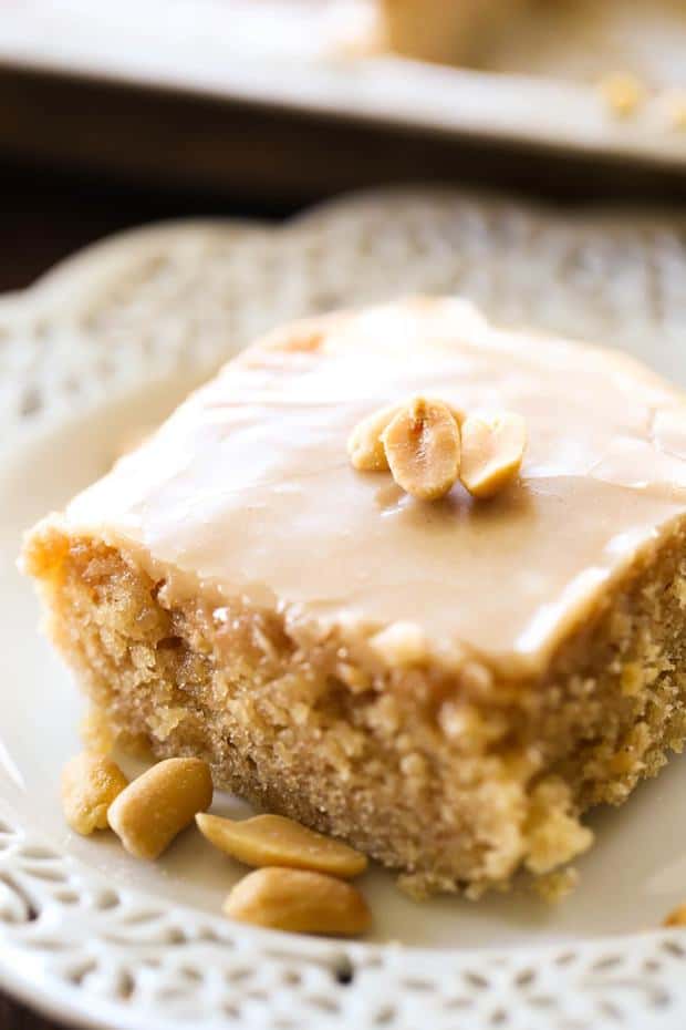 If you love peanut butter, then you absolutely need to try this MELT-IN-YOUR-MOUTH Peanut Butter Sheet Cake. It is truly amazing!