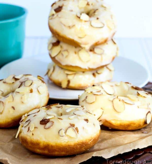 These Texas Almond Sheet Cake Donuts are my new best friends. Almond cake donuts dipped and dripped in the iconic Texas Sheet Cake icing only it’s almond flavored and topped off with slivered almonds.