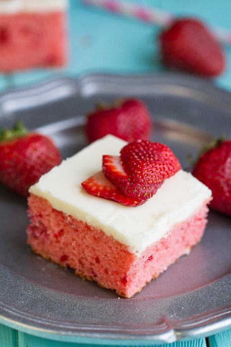 Strawberry Frosted Sheet Cake is a perfectly light and fluffy strawberry cake and best of all, it’s made from scratch with NO cake or jello mix. It’s full of fresh and freeze-dried strawberries and topped with an easy buttercream cream cheese frosting.