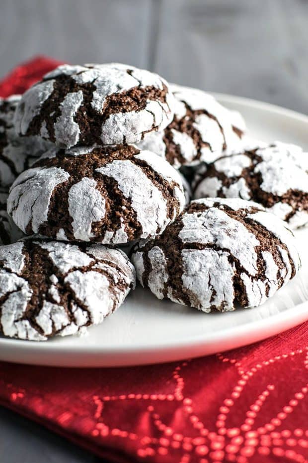 Chocolate cookies rolled in powdered sugar and baked to light & crumbly perfection. They're the perfect combination of brownies and crinkle cookies!