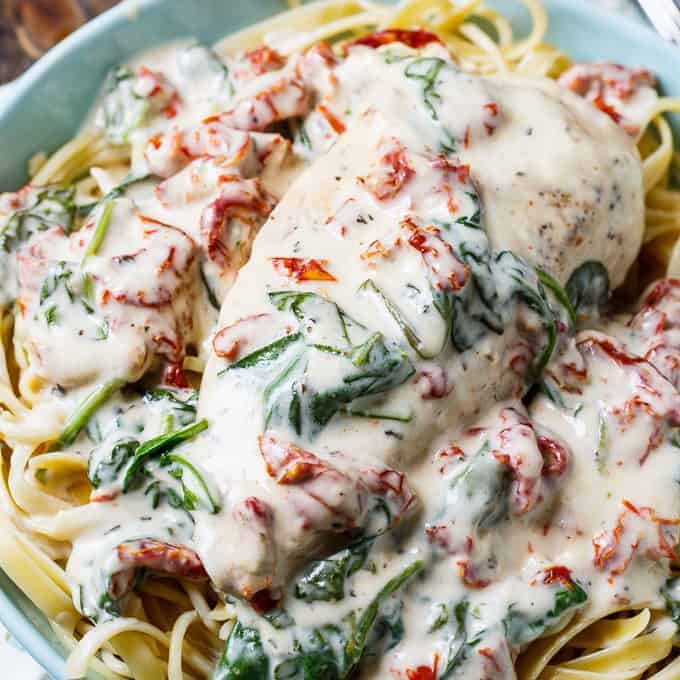 Slow Cooker Creamy Tuscan Chicken is the richest, creamiest crockpot meal you will ever eat, and it is so simple to make. It will probably become one of your new favorite dinners!