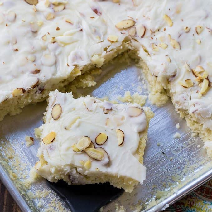 White Texas Sheet Cake is an exceptionally moist almond-flavored cake with a delicious almond-flavored icing. One of the great things about this sheet cake is it gets better with time, so it’s perfect to bake for a party or potluck when you don’t have the time to do it the day o