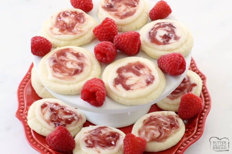Raspberry Meltaway Cookies just melt in your mouth! Perfect topped with a simple almond glaze swirled with raspberry jam.