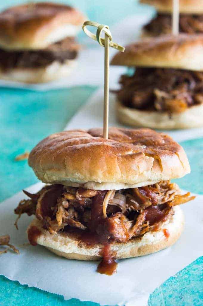 Perfect Slow Cooker Pulled Pork.  This Texas style pulled pork is made easier in the slow cooker.  Perfect for enjoying as a BBQ Pulled Pork Sandwich, or loaded up on nachos, or even as a pizza topping!  The possibilities are endless!