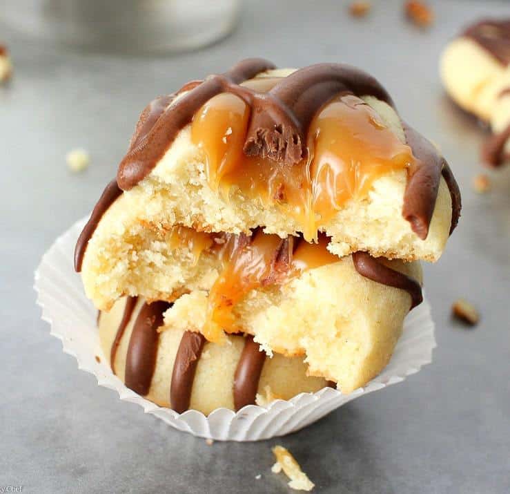 Turtle Twix Shortbread Cookies are easy to make shortbread cookies filled with a decadent caramel sauce and salty pecan pieces, drizzled with creamy melted chocolate…. they taste just like a Twix bar mixed with a turtle candy!
