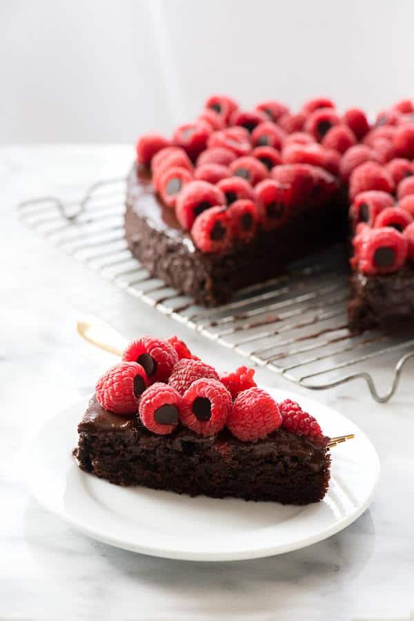 This Triple Chocolate Wacky Cake with Chocolate-Stuffed Raspberries is perfect for chocolate-lovers and those with food allergies alike. An easy to make, fudgy chocolate chip cake slathered with a chocolate ganache and topped with chocolate-stuffed raspberries. Gluten-free, dairy-free, vegan and free of the top 8 food allergens (but you’d never guess that when taking a bite!)