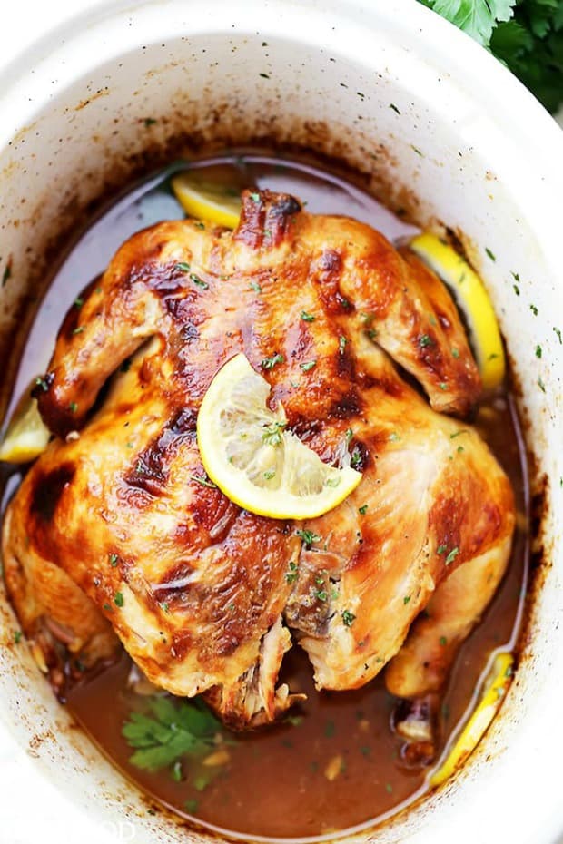 Crock Pot Honey Lemon Chicken Recipe – Rubbed with lemon-pepper butter and a sweet honey sauce, this is the easiest, most delicious whole chicken prepared in the crock pot!