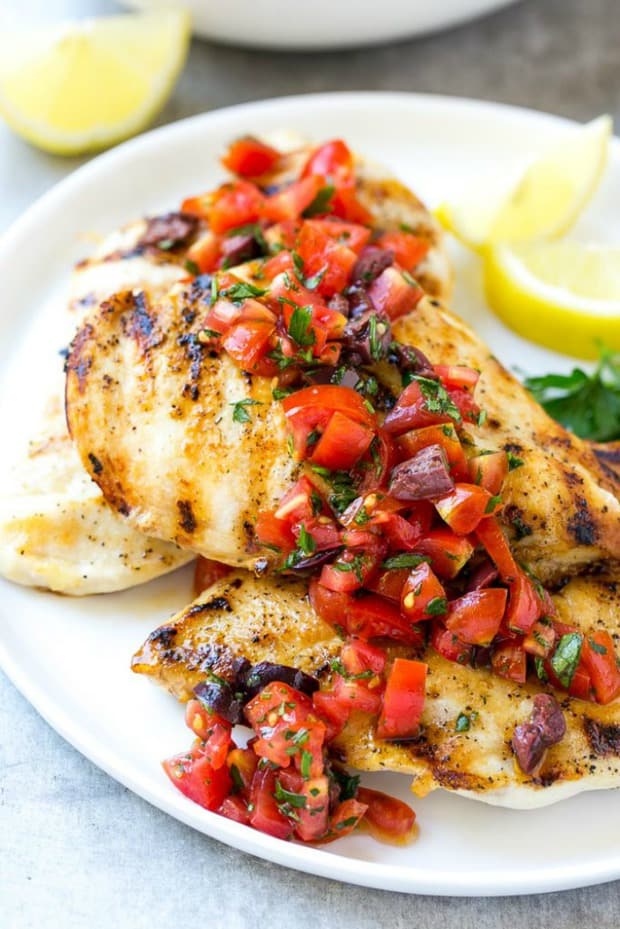  This recipe for Greek lemon chicken is marinated chicken that's been grilled to perfection and topped with a bright and delicious tomato and olive relish. The perfect dish for entertaining!
