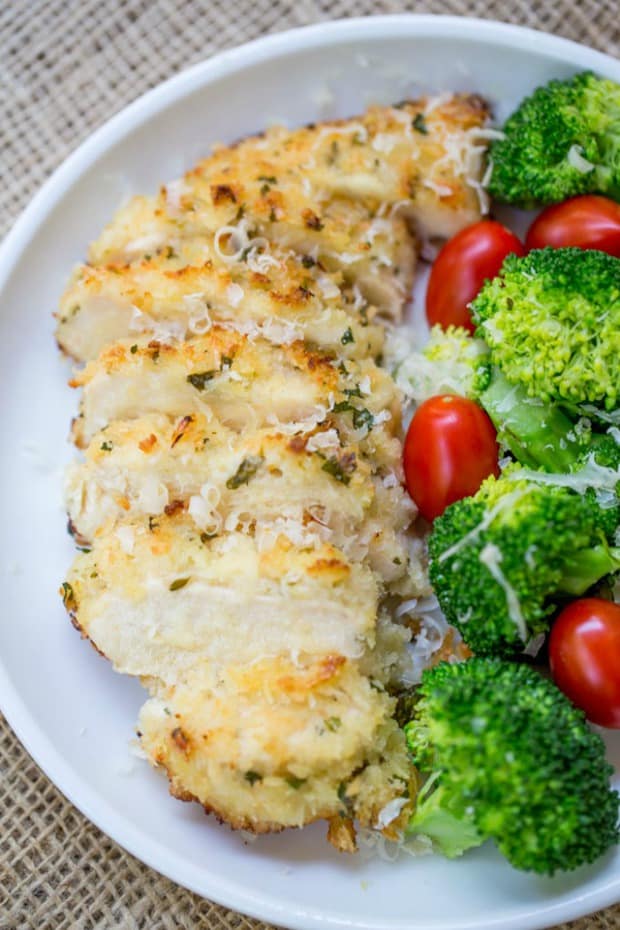 Crispy Baked Lemon Parmesan Chicken with fresh lemon, butter, garlic and Parmesan has all the flavors of your favorite scampi dish but in a healthier oven baked version.