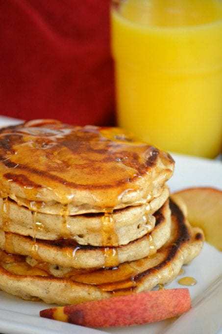Cinnamon Peach Pancakes – fluffy buttermilk pancakes spiced with cinnamon and flavored with fresh peaches. They make a great summer breakfast.