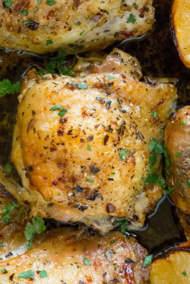 Easy Greek Lemon Chicken is made with just a handful of ingredients in a cast iron skillet along with roasted lemon wedges that make an easy pan sauce