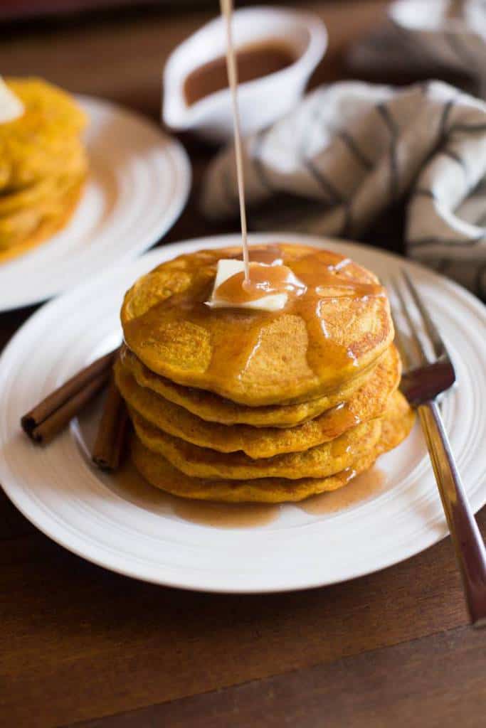 Light and fluffy pumpkin pancakes with a deliciously sweet cinnamon syrup.