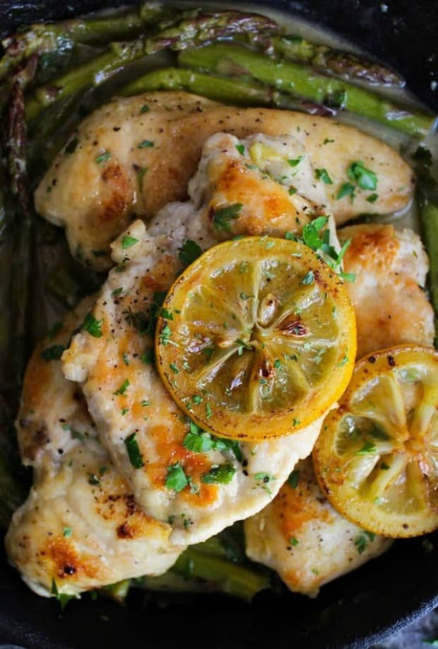 One Pan Lemon Chicken with braised asparagus in a simple lemon mustard sauce. Gluten Free + Whole30 + Paleo.