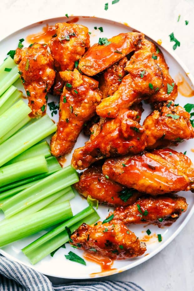 Baked Sticky Honey Garlic Buffalo Wings are baked to crispy perfection and topped with the most amazing honey garlic buffalo sauce.  These are finger licking good