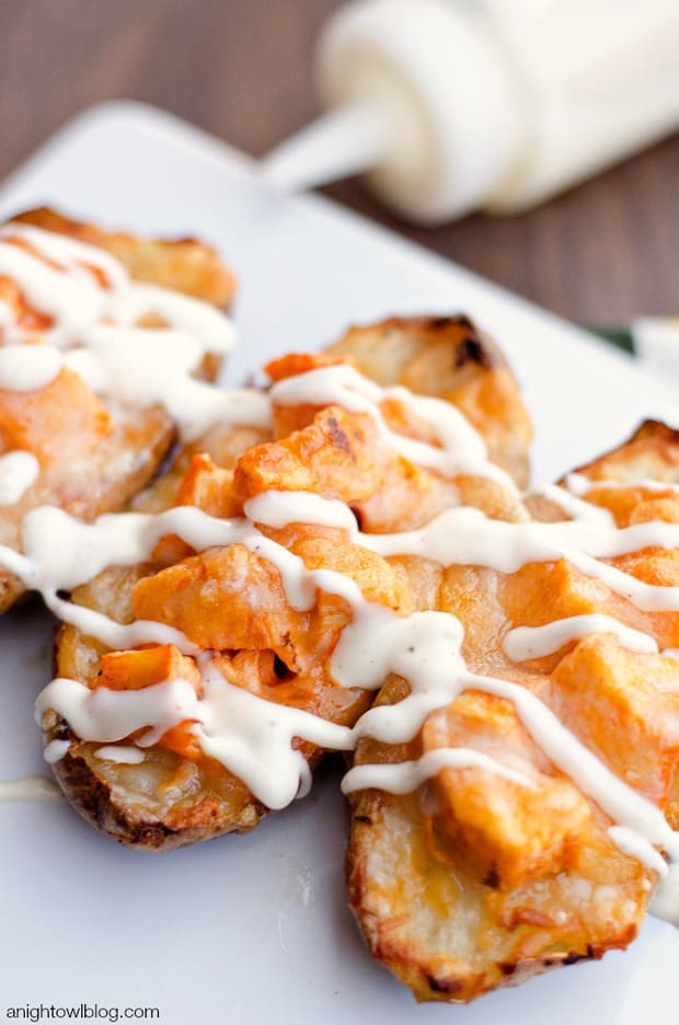Pull those babies out of the oven, drizzle with a little more ranch (or blue cheese!) dressing and voila – delicious Buffalo Chicken Twice Baked Potatoes! The world’s most perfect tailgating food, don’t you think? Really tasty and you know, not hard at all.