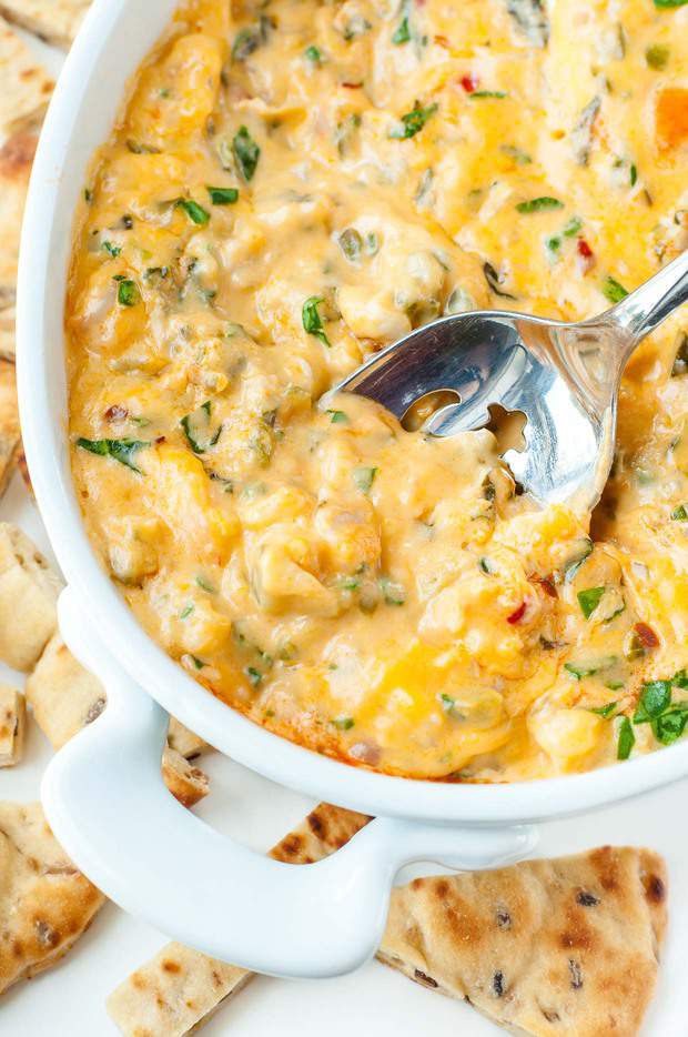 Whether you’re partying it up with friends or whipping up a date-night spread at home, this easy cheesy Buffalo Shrimp Dip makes the perfect appetizer! Hot melty cheese with shrimp, veggies, and a kiss of hot sauce? Perfection!