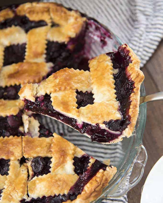 Blueberry Pie with the best flakey and buttery homemade crust and a delicious, lightly sweetened blueberry filling - perfect served warm with a big scoop of vanilla ice cream!