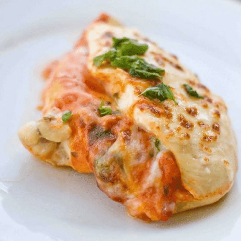 Easy Baked Stuffed Chicken Parmesan Recipe – This delicious, lighter chicken parmesan is baked to cheesy perfection with no gluten or grains, and tons of flavor! Tender juicy baked chicken with tons of gooey cheese for a lighter chicken parmesan the whole family will love.