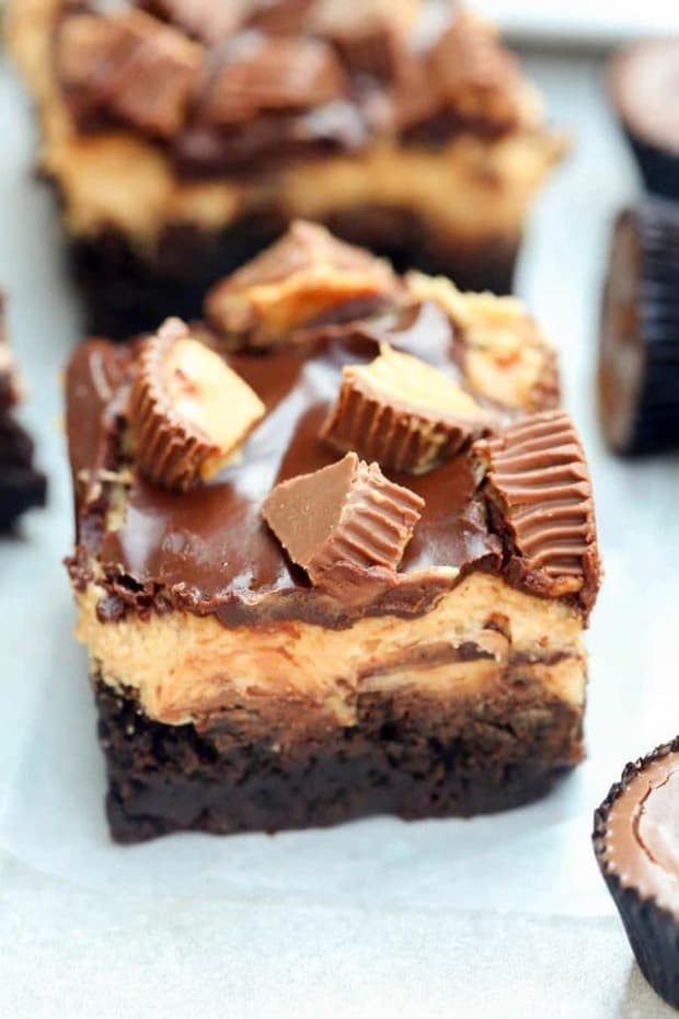 Reese’s Peanut Butter Brownies are chewy homemade brownies with an amazing smooth peanut butter frosting topped with chocolate glaze and mini reese’s cups.