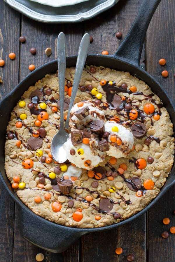 Reese’s Peanut Butter Oatmeal Skillet Cookie are perfectly soft, chewy and loaded with the best combo of peanut butter chips, mini Reese’s pieces, and Reese’s peanut butter cups. It’s a peanut butter lover’s dream!