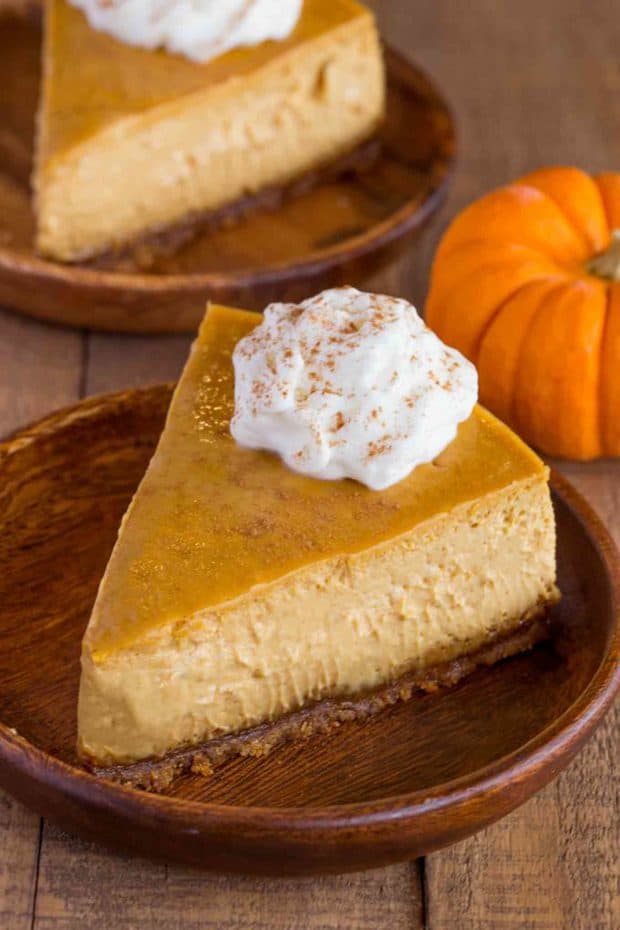 Pumpkin Cheesecake with a Gingersnap crust is a classic holiday dessert that is creamy and rich with fresh pumpkin and homemade pumpkin spice flavors.