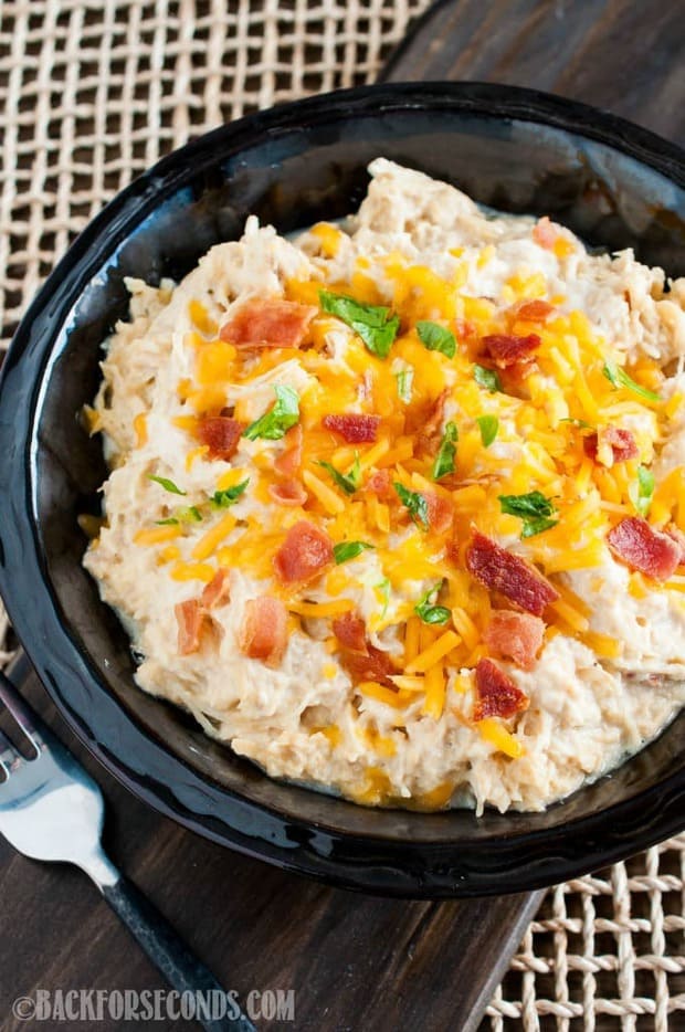 Crock Pot Cheesy Bacon Ranch Chicken is one of the easiest and most delicious chicken recipes ever! Wondering what to make for dinner tonight? This is it!