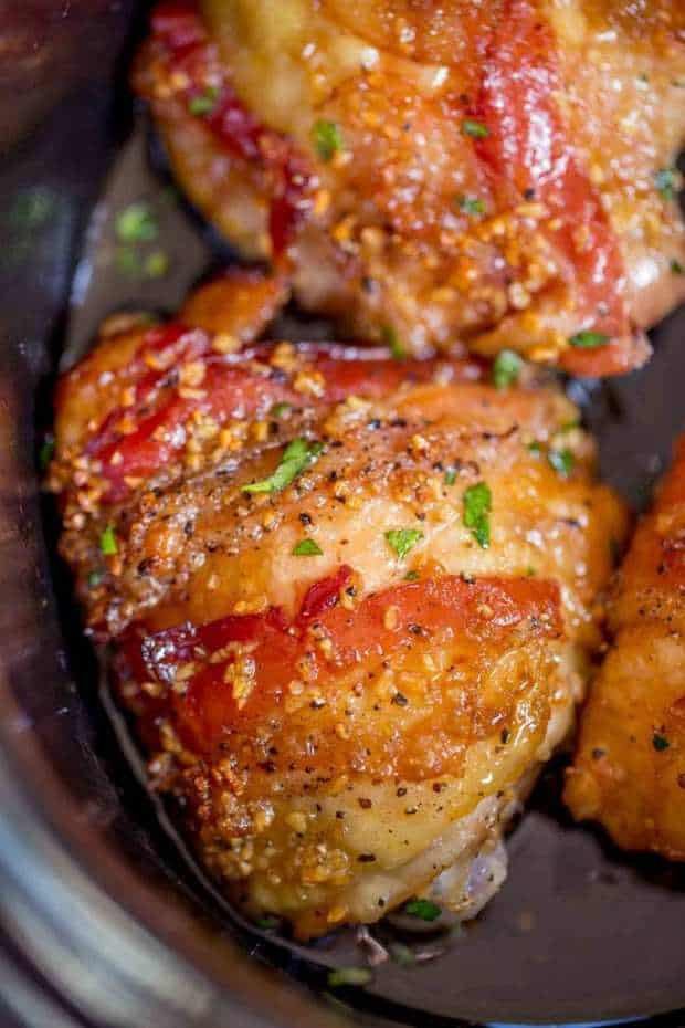 Slow Cooker Bacon Brown Sugar Garlic Chicken is made with just five ingredients in your slow cooker. Sticky, garlicky, sweet fall apart bacon and chicken.
