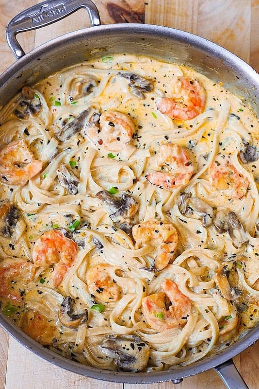 A dish is filled with food, with Shrimp and Pasta