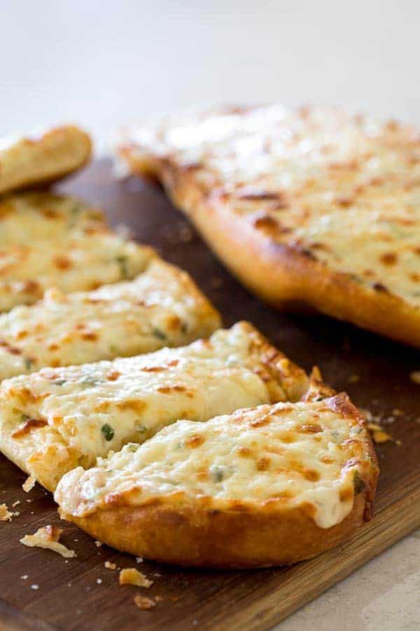 Black Angus Cheesy Garlic Bread is perfect to serve with your favorite Italian meal or that steak you’re grilling. It’s ooey, gooey, rich and buttery, and crisp and crunchy.