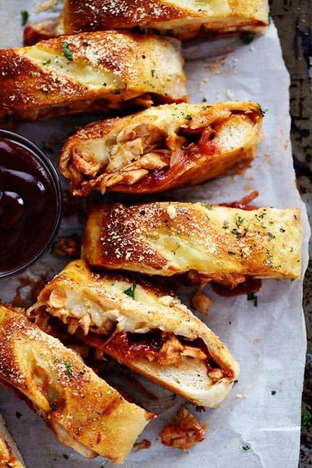 BBQ Chicken Stromboli is full of melty provolone cheese, chicken, caramelized red onions and sweet and tangy bbq sauce.  This makes an amazing quick and easy meal or appetizer!