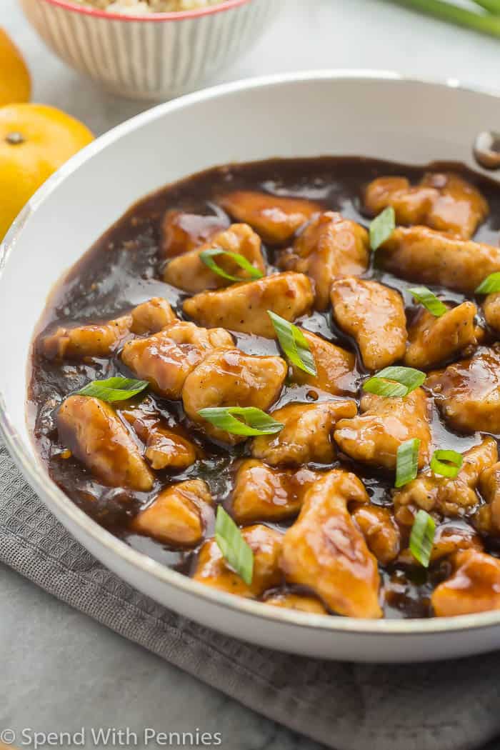 Skillet Orange Chicken Recipe is so easy to make — it comes together in 30 minutes or less! Serve it with rice and steamed vegetables or salad and you have an easy weeknight meal and you didn’t even have to get takeout.