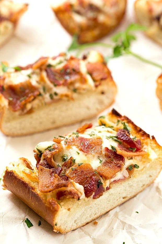 Cheesy Bacon Ranch Garlic Bread – Not just another cheesy garlic bread recipe! This bread is fantastic, and we were able to stop eating it! With a few changes, you can have homemade, and this easy garlic bread is taken to a whole new level! The best garlic spread with the addition of ranch seasoning!